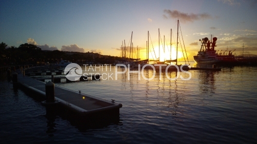 Sunset And Boats In Port Of Tahiti
