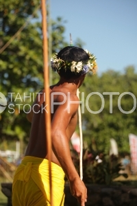 Young man with traditional javelin during Heiva festival