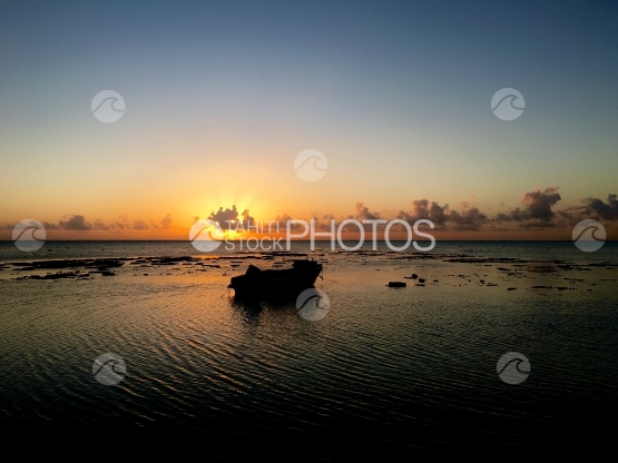 Fishingboat in the lagoon of Hauru, Moorea, during sunset