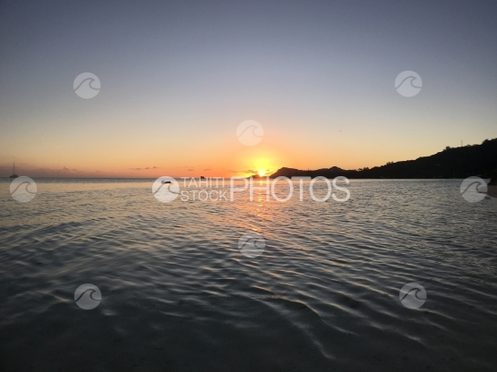 Sunset scenery at famous Matira beach, Bora Bora