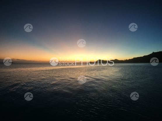 Sunset scenery at famous Matira beach, Bora Bora