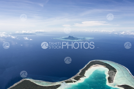 Tupai, aerial view of the atoll and Bora Bora in the background