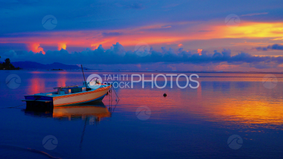 Fishing boat in the lagoon at the Sunrise, Raiatea