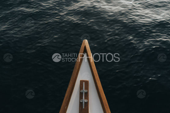 BORA BORA, front of TRADITIONAL POLYNESIAN OUTRIGGER on the lagoon