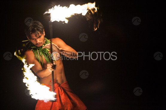 BORA BORA, PORTRAIT OF POLYNESIAN MEN WITH FIRE TORCH AT NIGHT