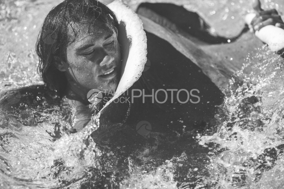 Polynesian man with  sting ray in the lagoon of Bora Bora