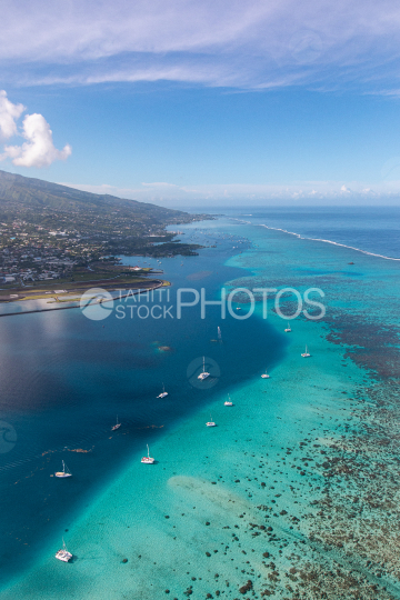 Tahiti, aerial photography of sailboats anchored in the lagoon of Faaa