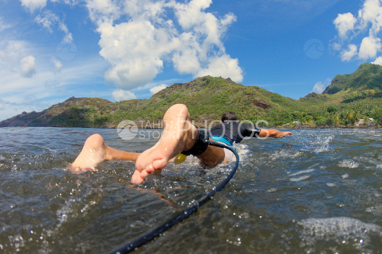 surfer in the bay of Nuku Hiva