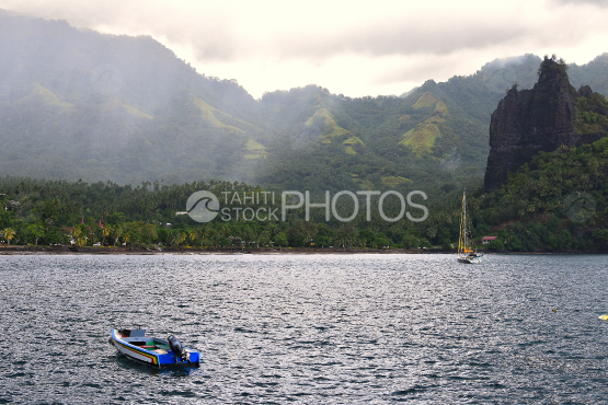Boats in the hatiheu bay, north of nuku hiva 