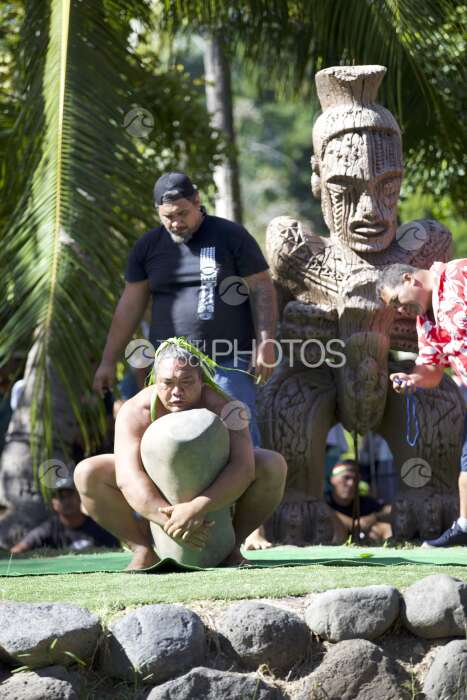 Traditional polynesian sports contest, heavy stone lifting, Tahiti, French Polynesia