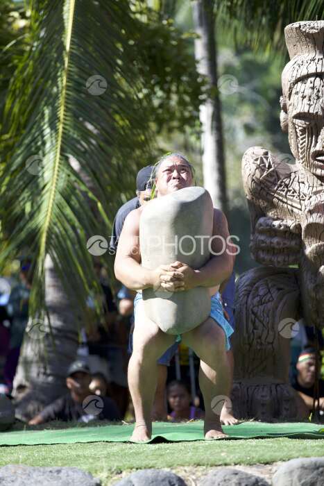 Traditional polynesian sports contest, heavy stone lifting, Tahiti, French Polynesia