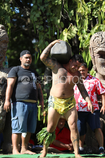 Tahiti, Man lifting a heavy stone, Stone lifting competition, Tuaro Maohi, Polynesia